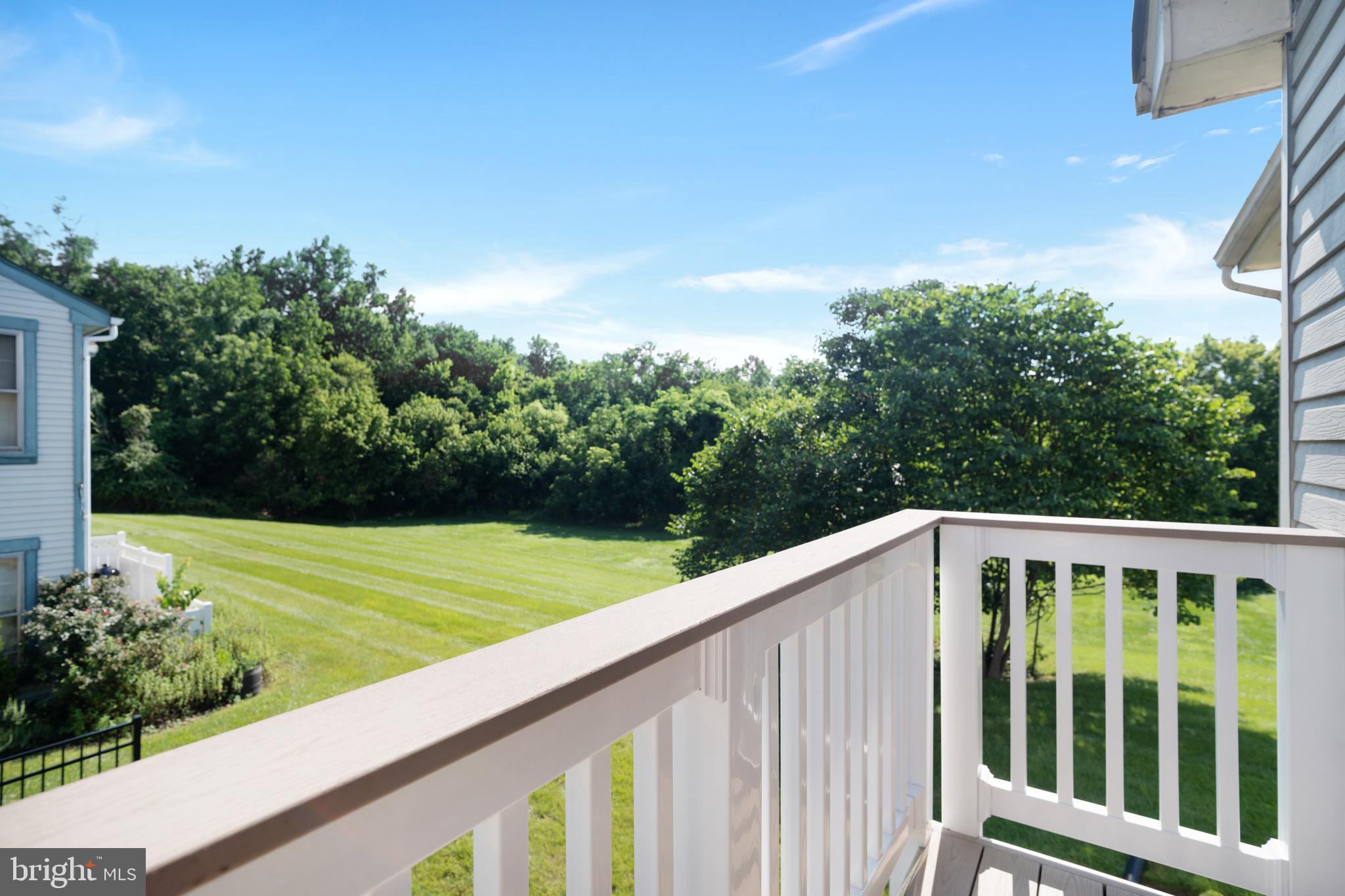 9448 Trevino Terrace, Unit 96 Laurel, MD 20708 - Photo 23 of 38 a view of balcony with wooden floor and fence