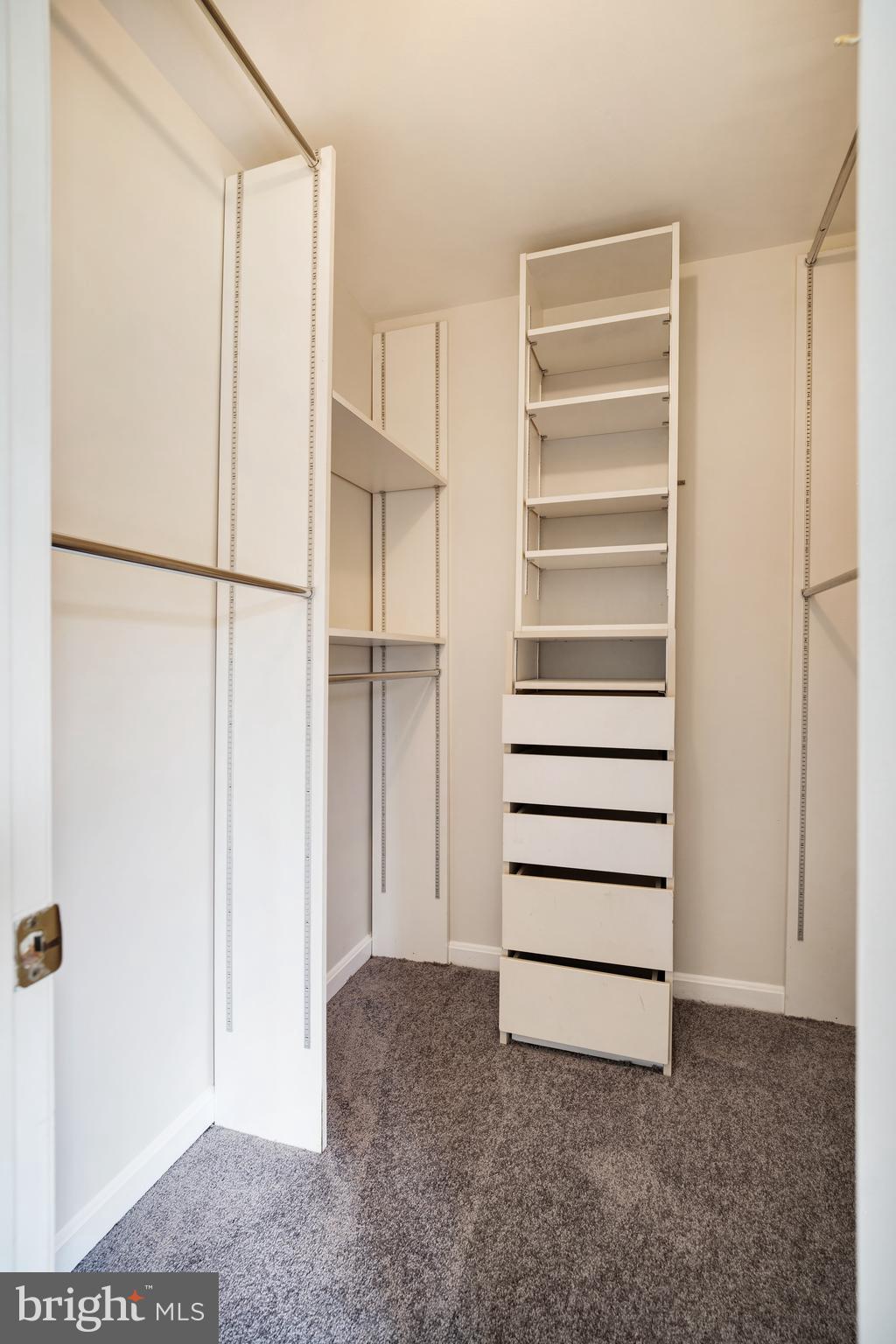 9448 Trevino Terrace, Unit 96 Laurel, MD 20708 - Photo 34 of 38 a view of closet area with empty racks