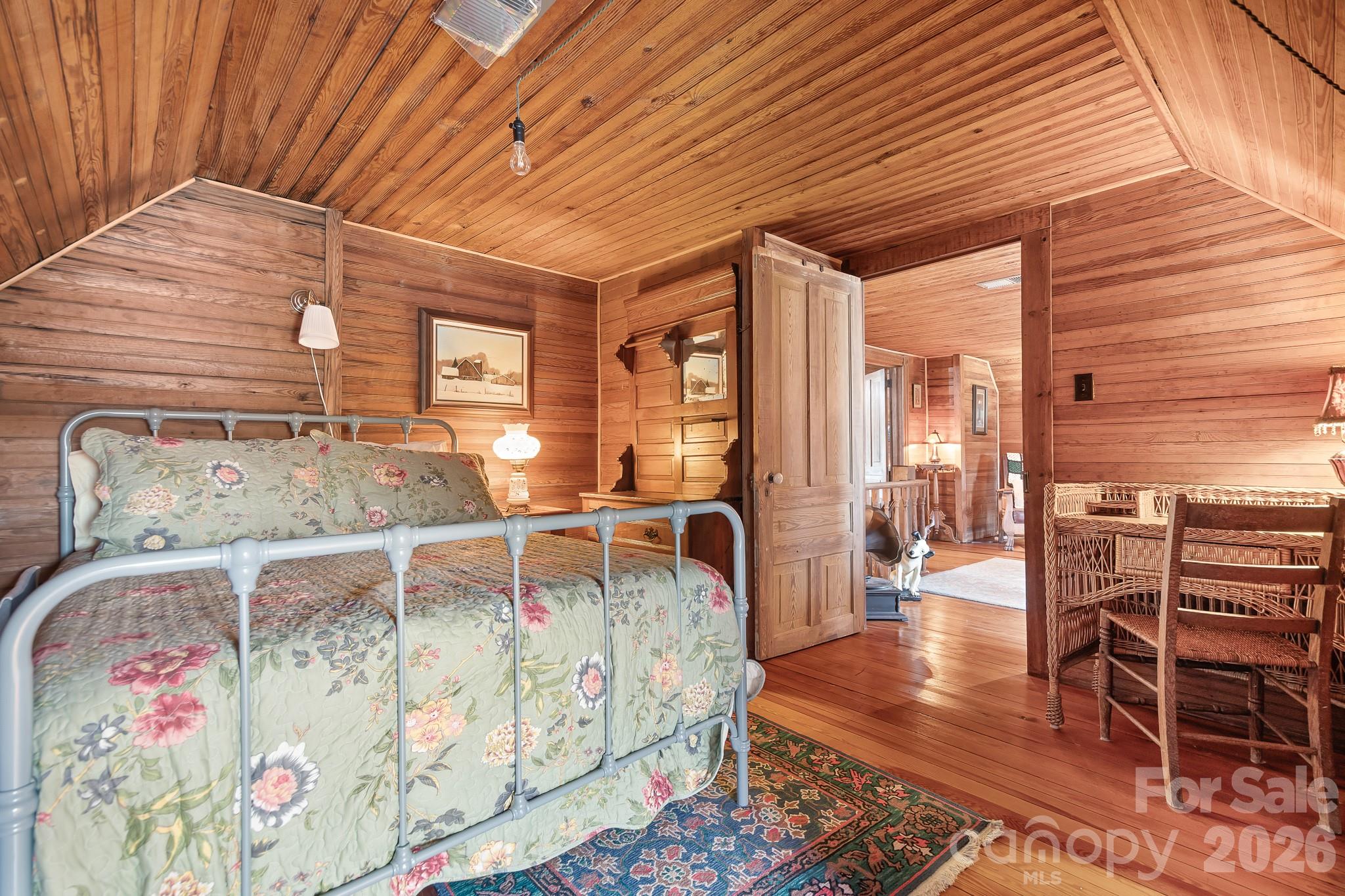 1315 Scotts Creek Road Statesville, NC 28625 - Photo 15 of 30 a bedroom with furniture and wooden floor
