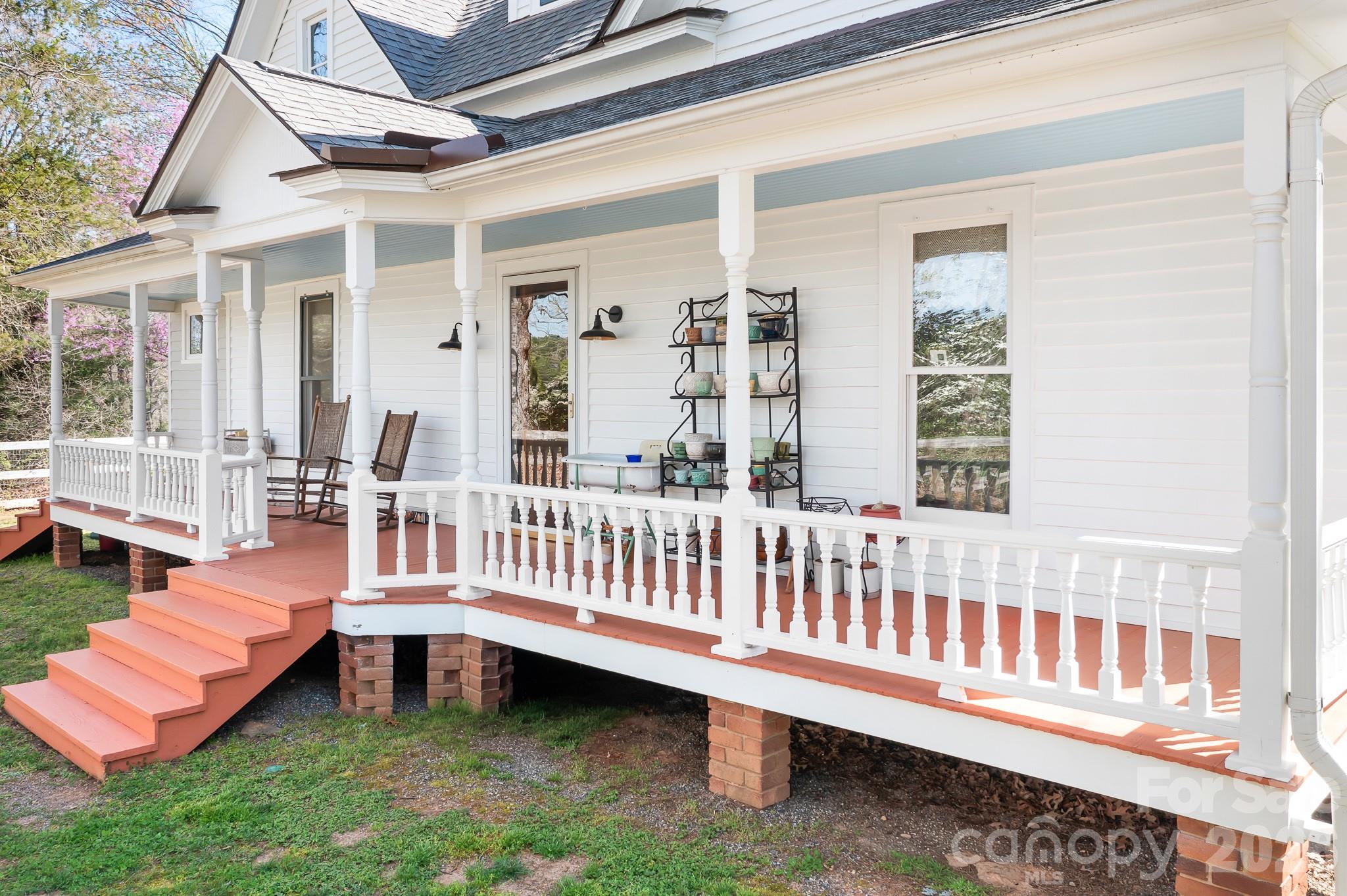 1315 Scotts Creek Road Statesville, NC 28625 - Photo 19 of 30 a view of a deck with a table and chairs