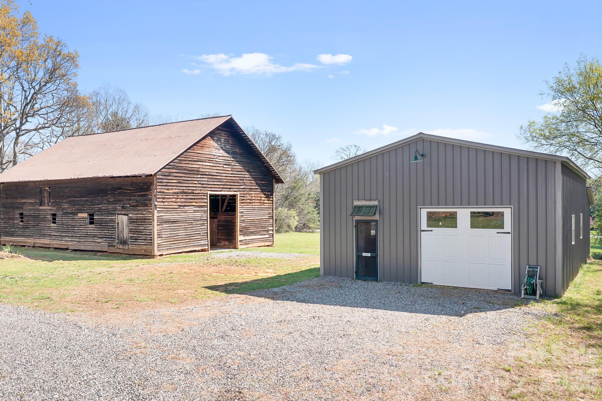 1315 Scotts Creek Road Statesville, NC 28625 - Photo 22 of 30 a front view of house with yard and trees in the background