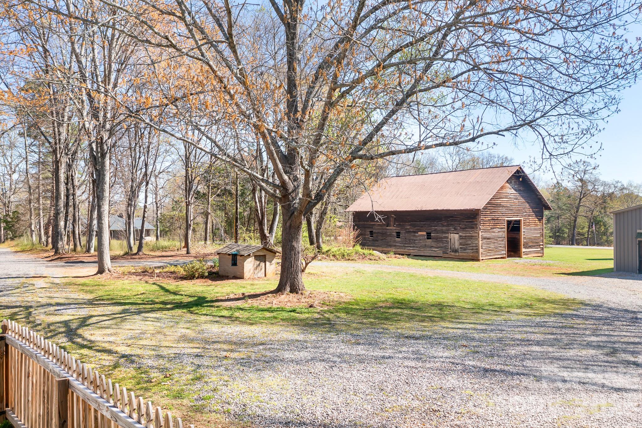 1315 Scotts Creek Road Statesville, NC 28625 - Photo 29 of 30 a house that has a tree in front of it
