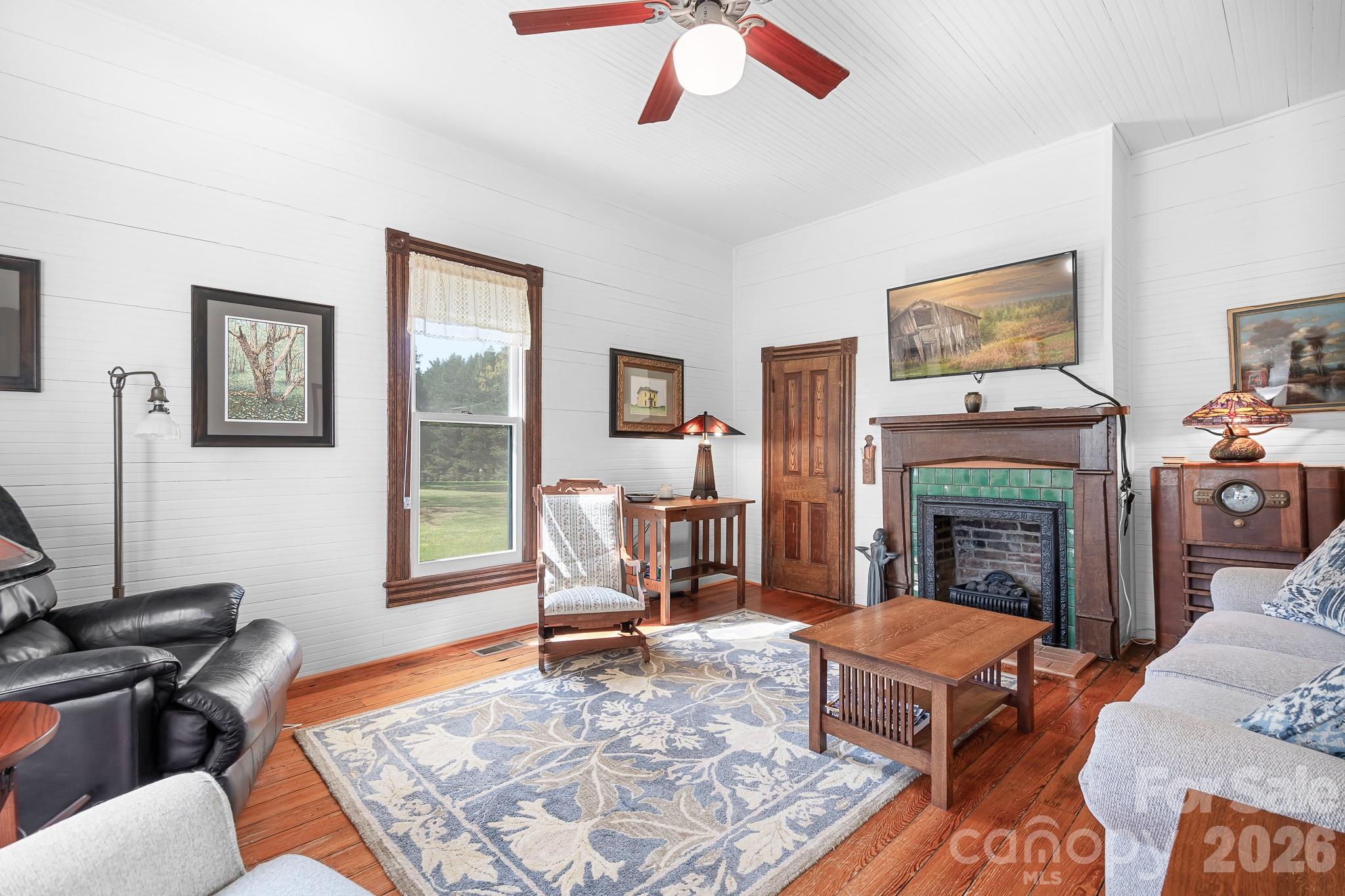 1315 Scotts Creek Road Statesville, NC 28625 - Photo 6 of 30 a living room with furniture and a fireplace