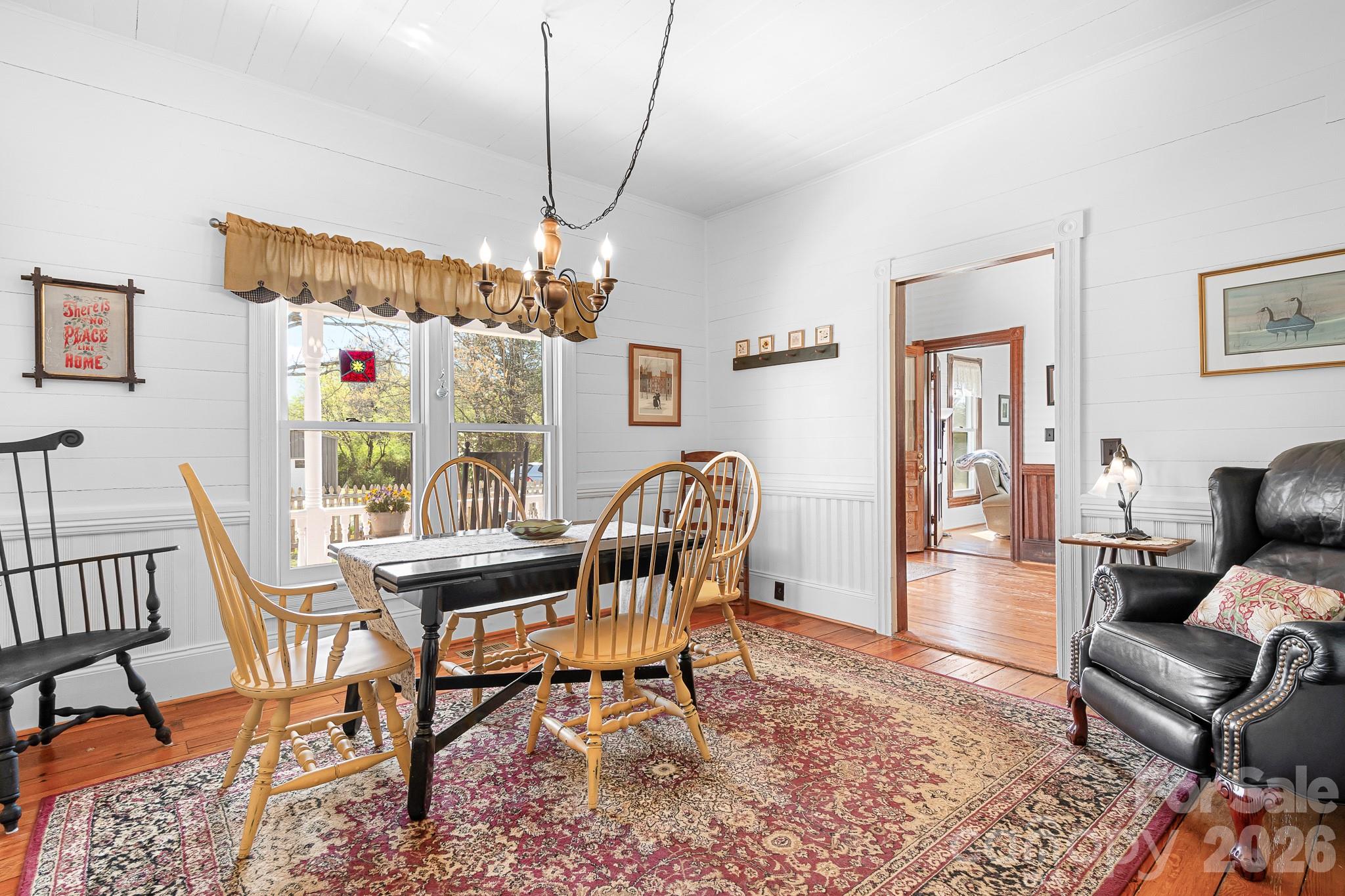 1315 Scotts Creek Road Statesville, NC 28625 - Photo 7 of 30 a living room with furniture a chandelier and a rug