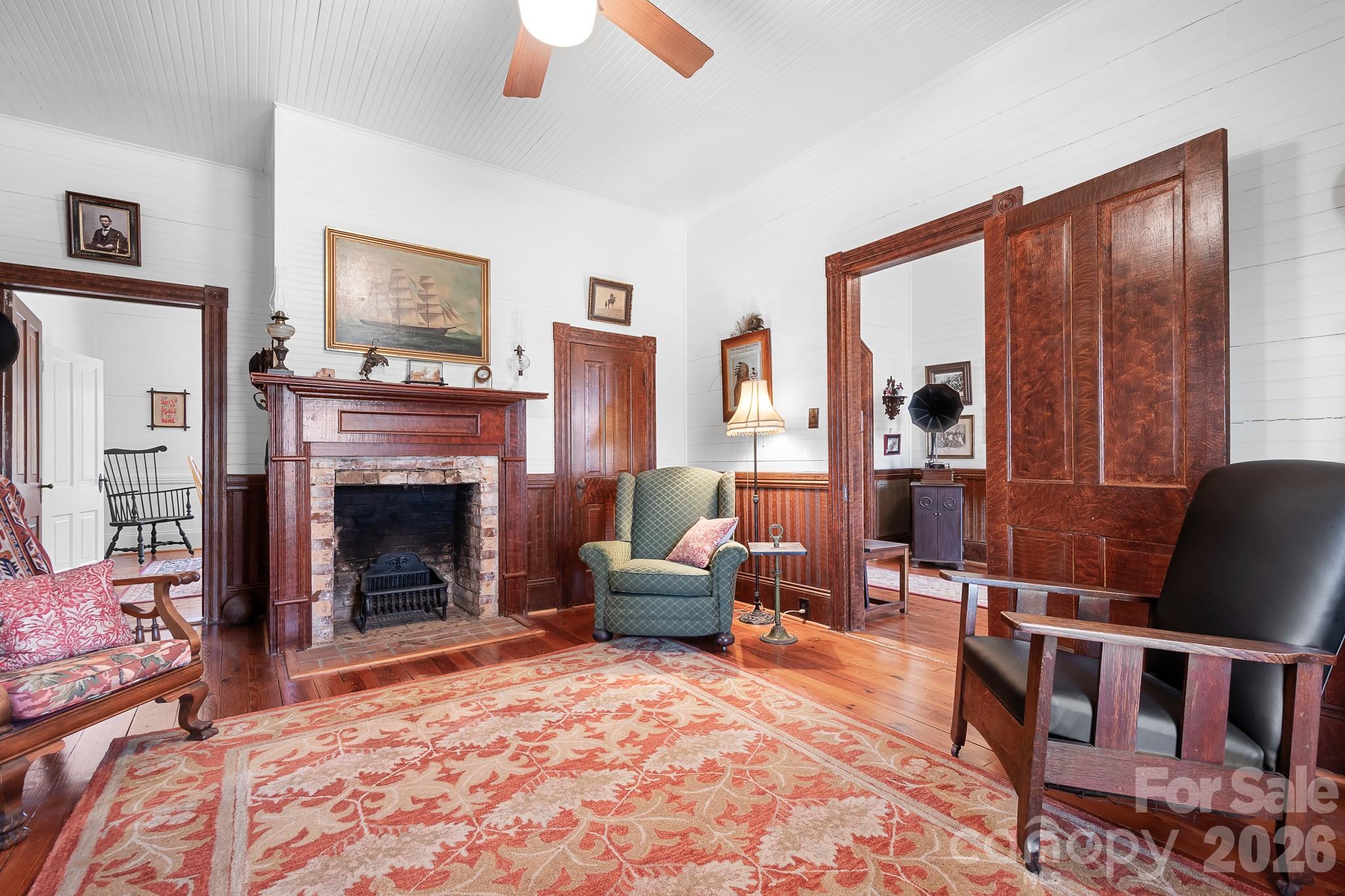 1315 Scotts Creek Road Statesville, NC 28625 - Photo 10 of 30 a living room with furniture and a fireplace