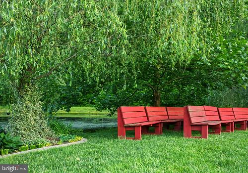 7017 Morris Road Spotsylvania, VA 22551 - Photo 12 of 23 a patio with table and chairs with plants and trees