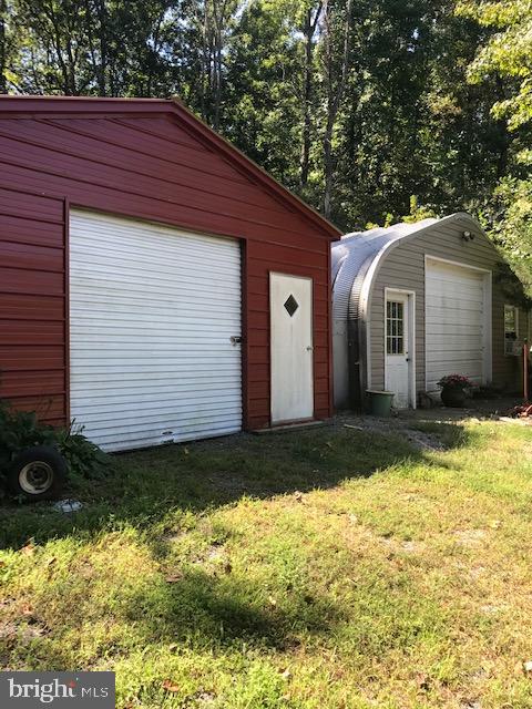 7017 Morris Road Spotsylvania, VA 22551 - Photo 18 of 23 a view of a small house in the back yard
