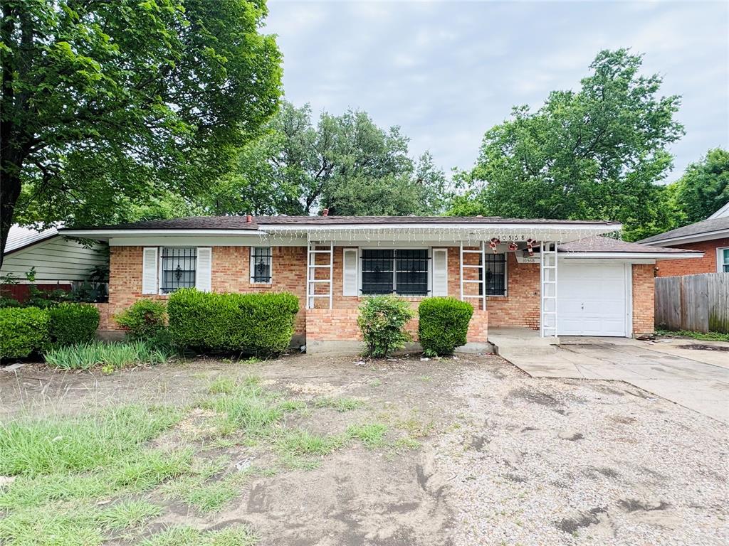 10568 Ferguson Road Dallas, TX 75228 - Photo 1 of 1 Brick exterior with white shutters and security bars