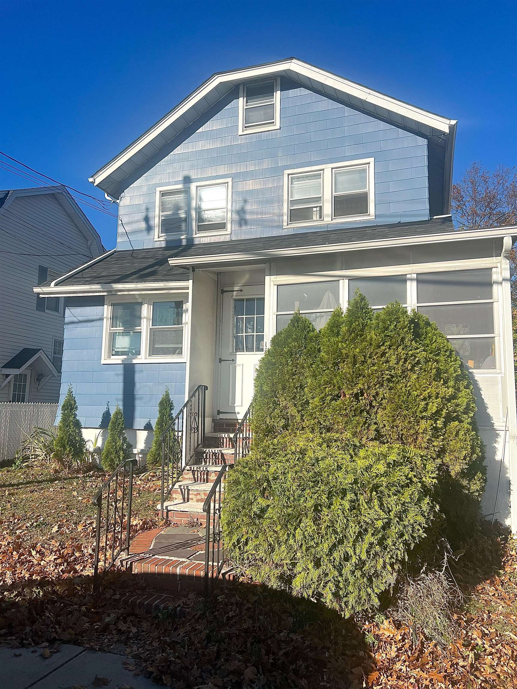 128 Hazelton Street, Unit 2 Ridgefield Park, NJ 07660 - Photo 1 of 6 a front view of a house with a garden
