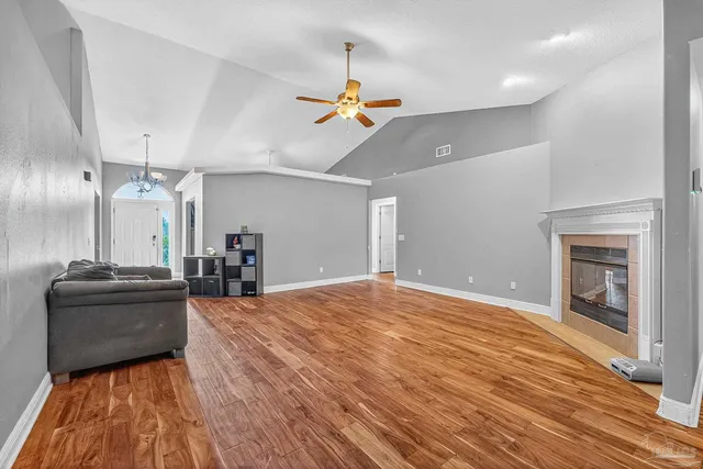 a view of a livingroom with a ceiling fan and window