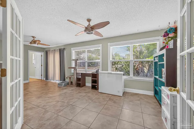 a kitchen with stainless steel appliances granite countertop a stove a sink dishwasher and a refrigerator with wooden cabinets