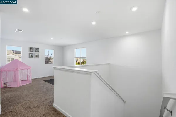 a utility room with cabinets washer and dryer