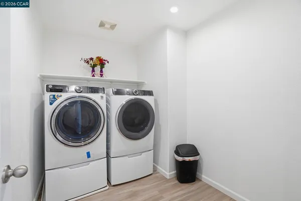 a utility room with dryer and washer