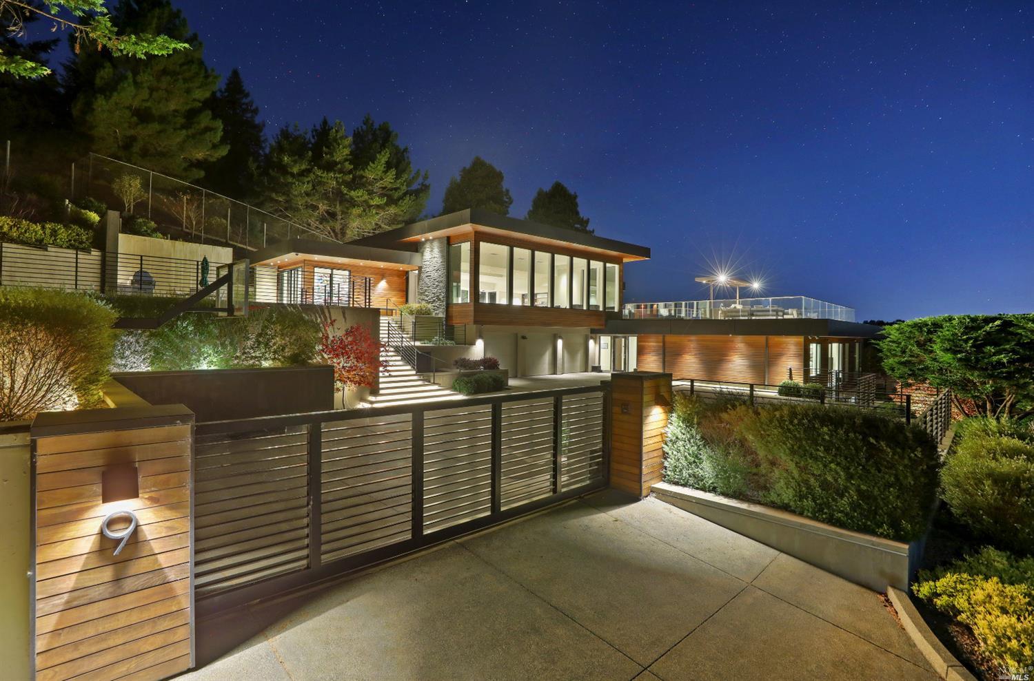 a view of a brick house with large windows