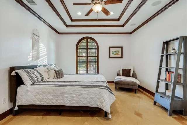 a bedroom with bed and window