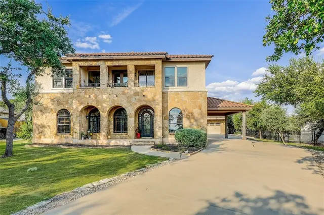 a front view of house with yard and green space