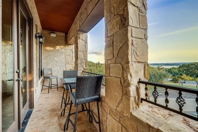 a view of balcony with furniture