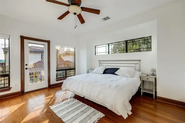 a bedroom with a bed and large mirror