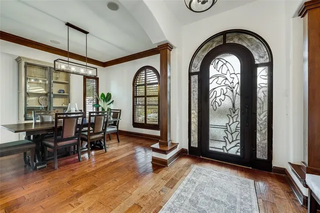 a view of a livingroom with furniture and floor to ceiling window