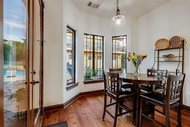 a view of a dining room with furniture window and wooden floor