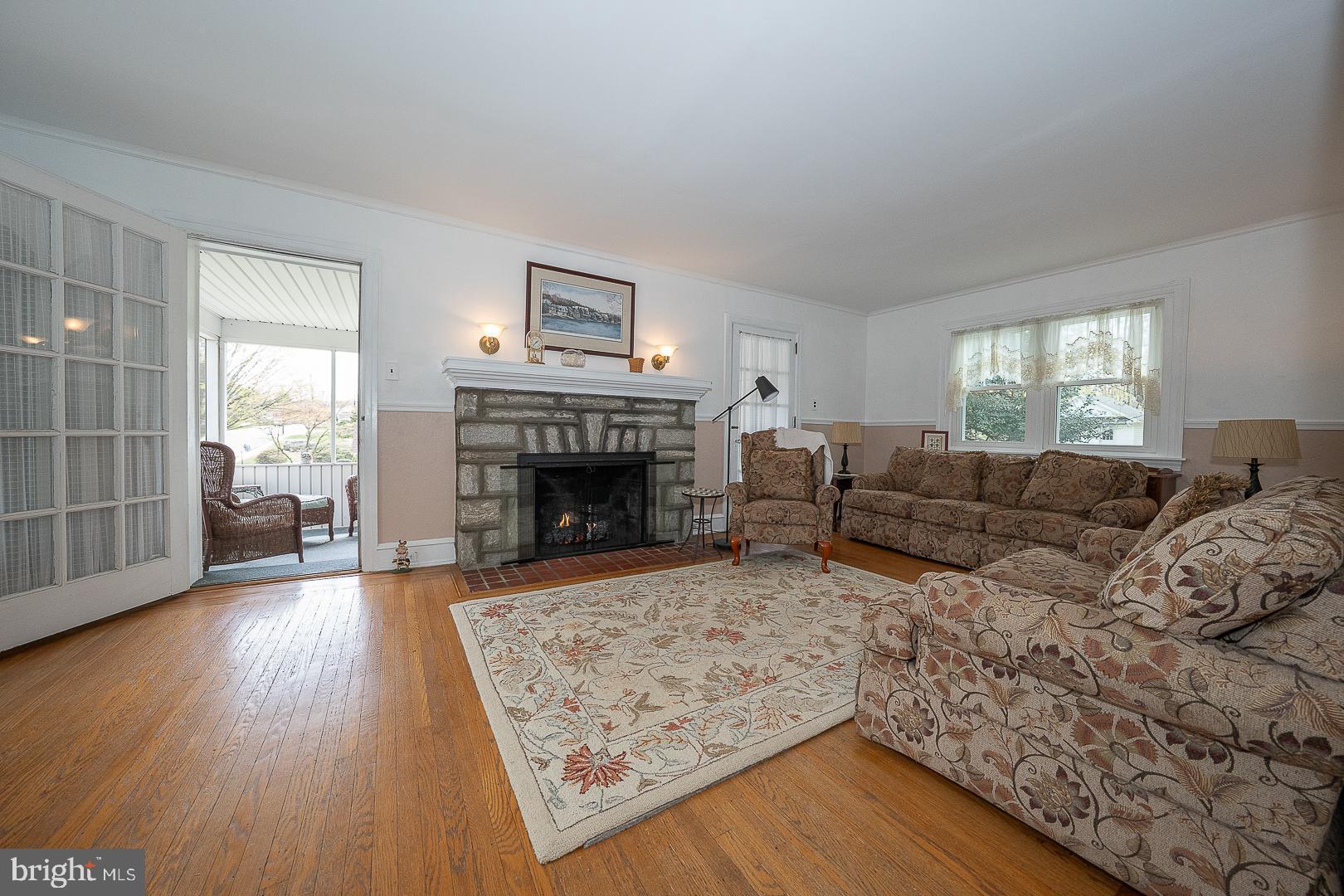 361 Summit Road Springfield, PA 19064 - Photo 16 of 42 a living room with furniture and a fireplace