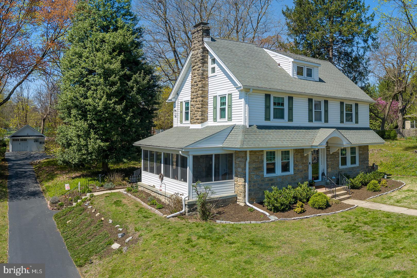 361 Summit Road Springfield, PA 19064 - Photo 2 of 42 a front view of a house with a yard table and chairs