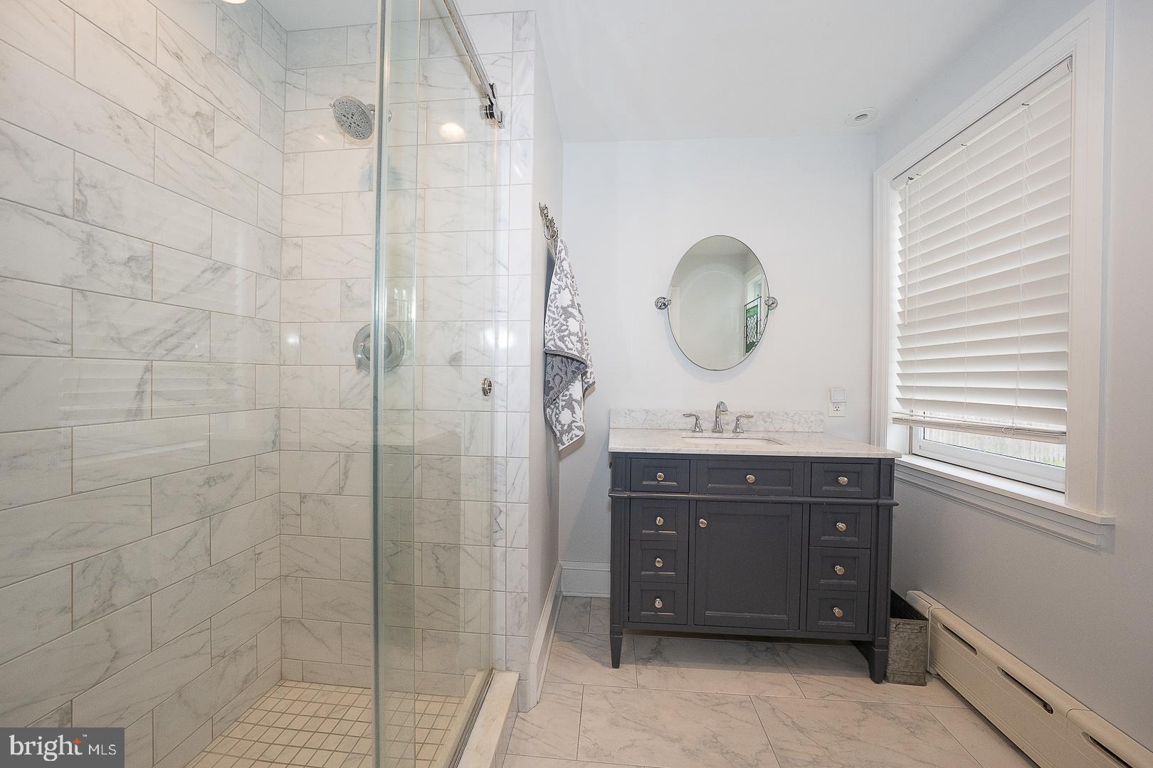 361 Summit Road Springfield, PA 19064 - Photo 25 of 42 a bathroom with a sink vanity and a mirror