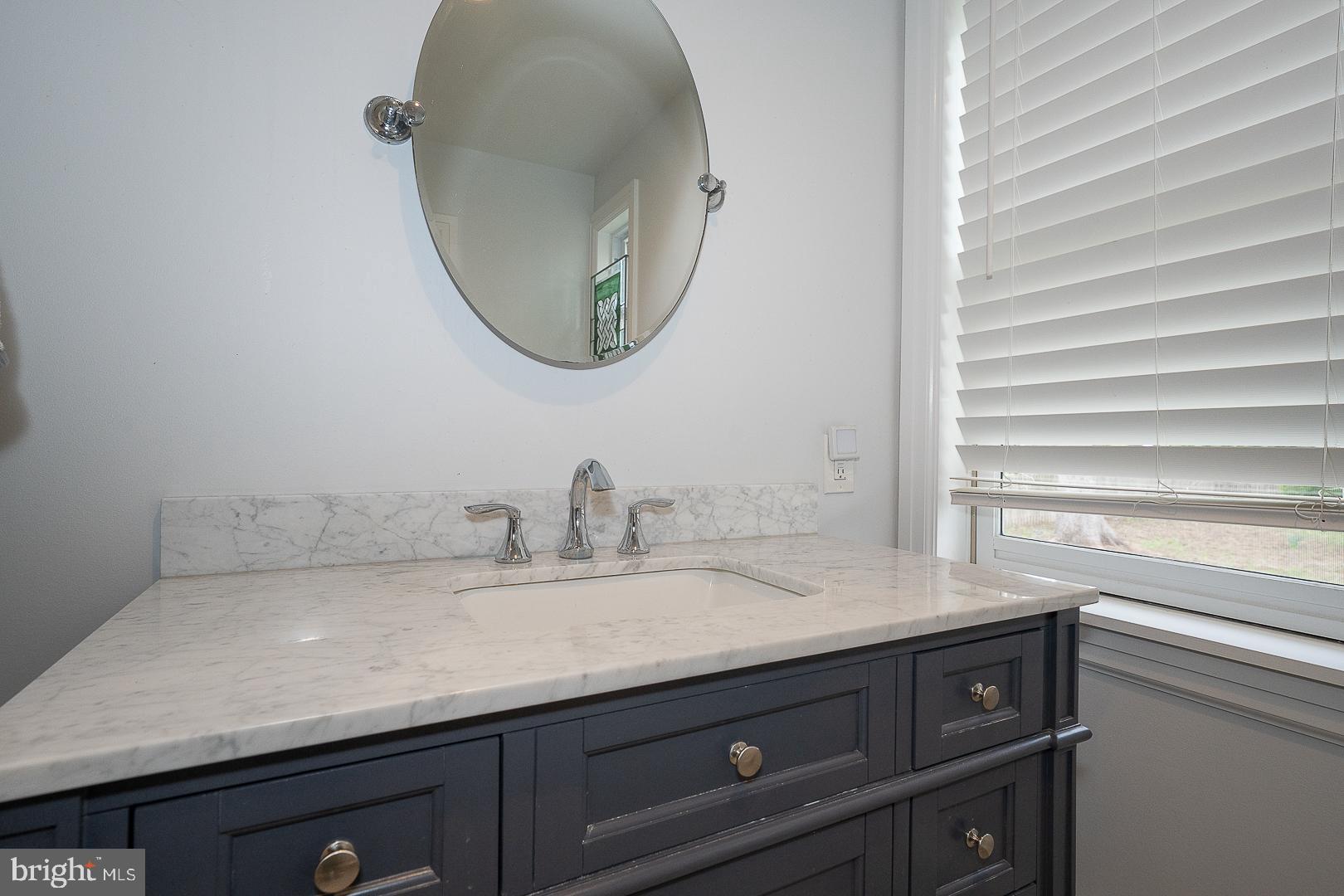 361 Summit Road Springfield, PA 19064 - Photo 26 of 42 a bathroom with a granite countertop sink and a mirror