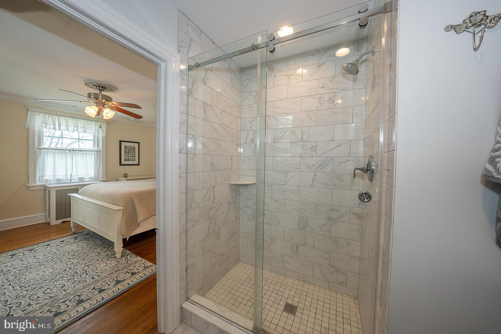 361 Summit Road Springfield, PA 19064 - Photo 27 of 42 a bathroom with a granite countertop bathtub shower sink and mirror