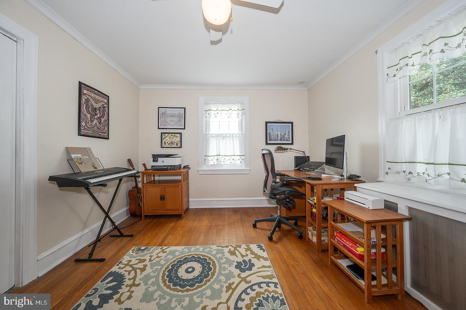 361 Summit Road Springfield, PA 19064 - Photo 32 of 42 a view of a workspace with furniture and a window