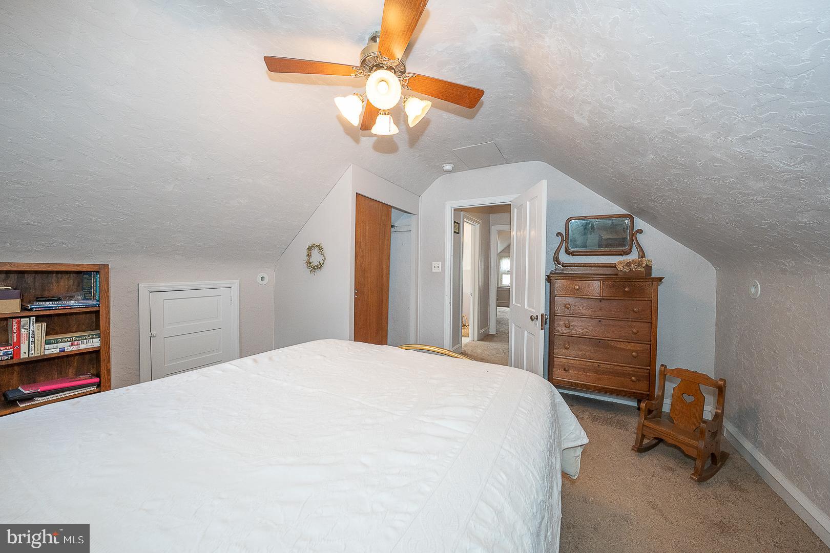 361 Summit Road Springfield, PA 19064 - Photo 33 of 42 a bedroom with a bed and a chandelier