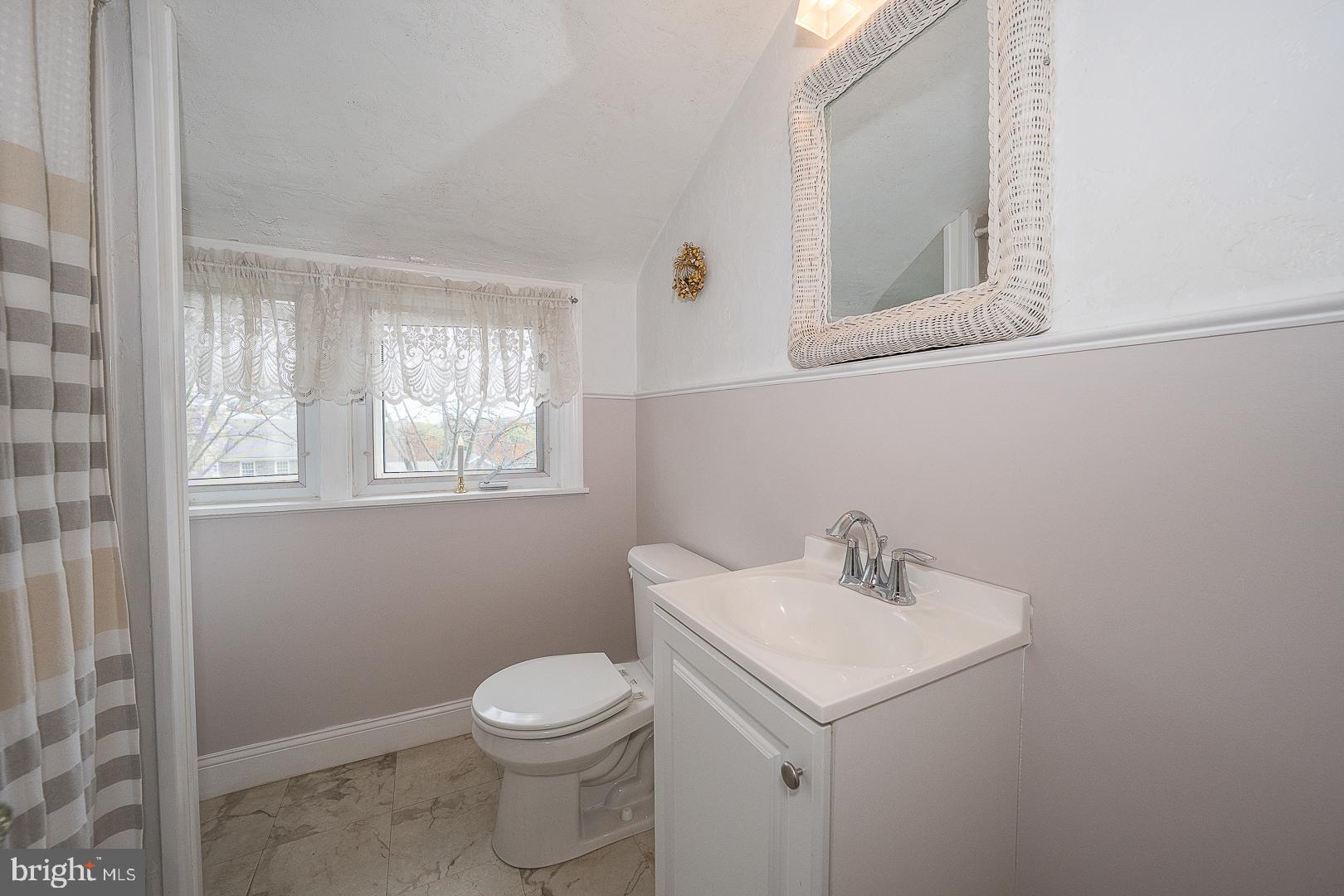 361 Summit Road Springfield, PA 19064 - Photo 34 of 42 a bathroom with a sink a toilet and a mirror
