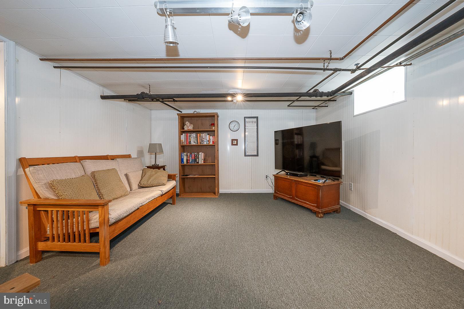 361 Summit Road Springfield, PA 19064 - Photo 37 of 42 a living room with furniture and a flat screen tv