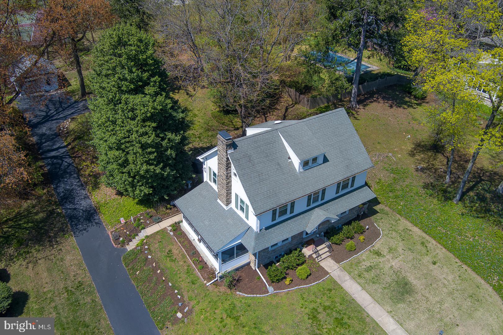 361 Summit Road Springfield, PA 19064 - Photo 40 of 42 an aerial view of a house with swimming pool and a yard