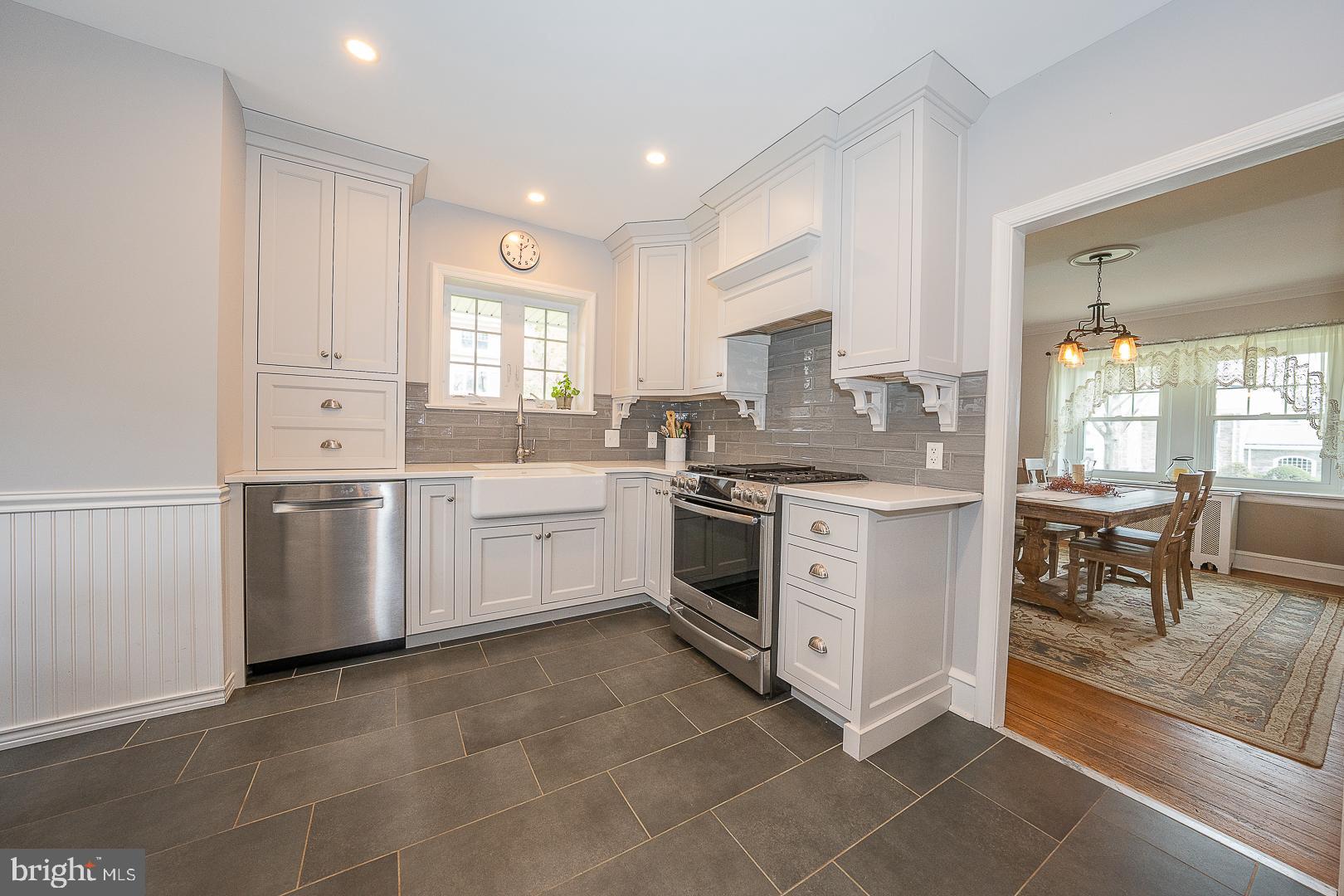 361 Summit Road Springfield, PA 19064 - Photo 10 of 42 a kitchen with white cabinets and white appliances