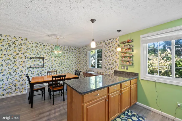a kitchen with a table and chairs
