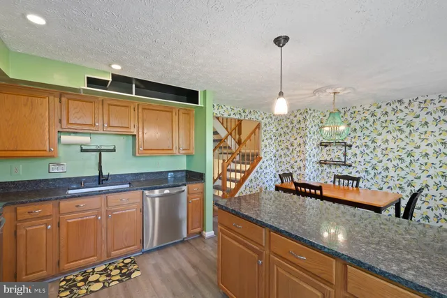 a kitchen with sink and cabinets