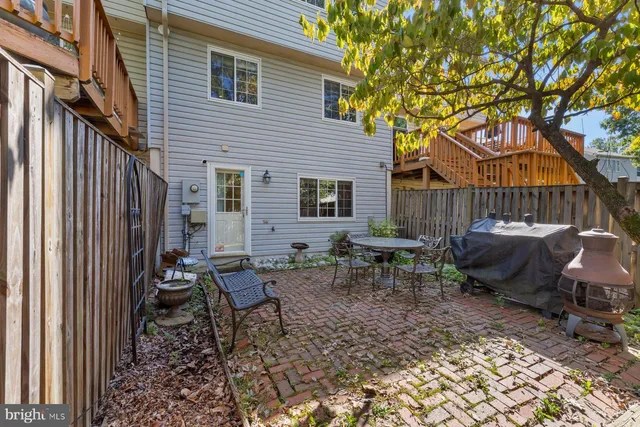 a backyard of a house with outdoor seating