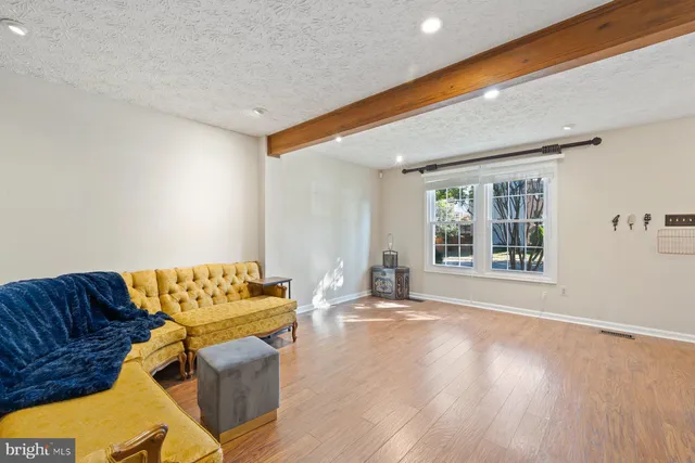 a living room with a couch and a window