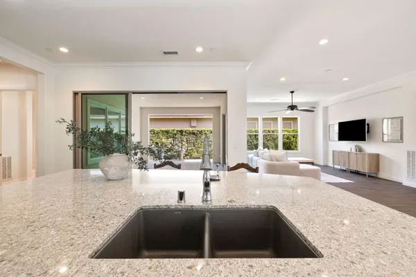 a view of living room filled with furniture and window