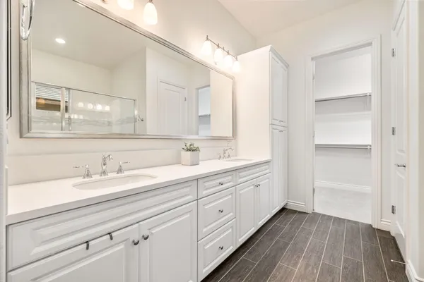a bathroom with a glass shower door