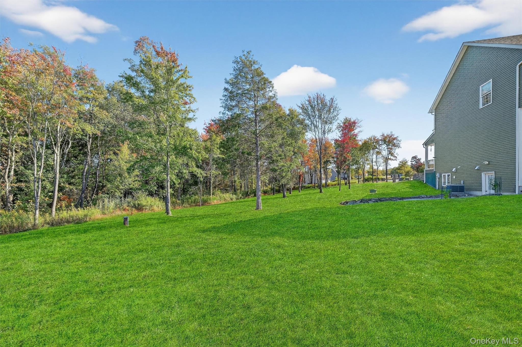 10 Domingues Road Newburgh, NY 12550 - Photo 20 of 30 Expansive green lawn with mature trees and natural landscaping