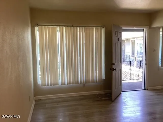 a view of entryway with wooden floor
