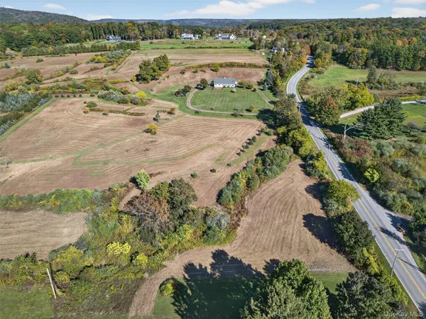 an aerial view of a houses with a lake view
