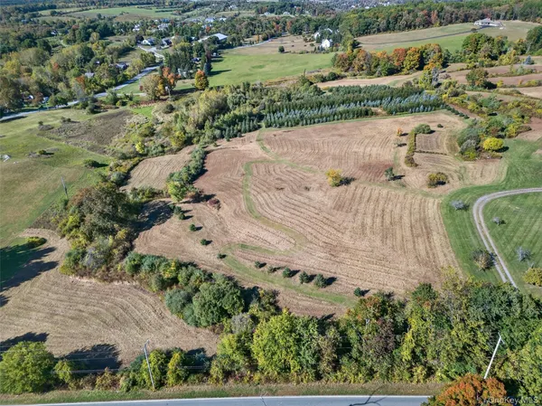 an aerial view of a residential houses with outdoor space