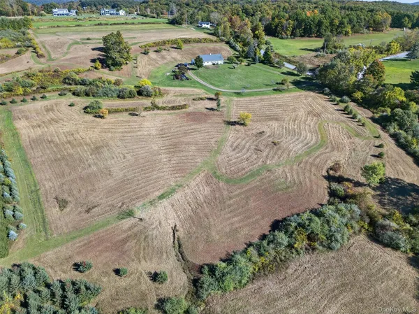 an aerial view of a houses with a lake view