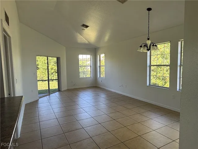 a view of an empty room and window