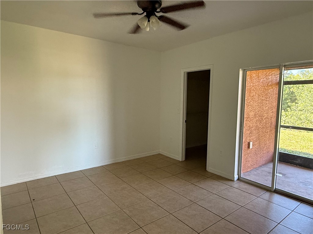633 Alabama Road South, Unit 635 Lehigh Acres, FL 33974 - Photo 15 of 19 a view of an empty room and window