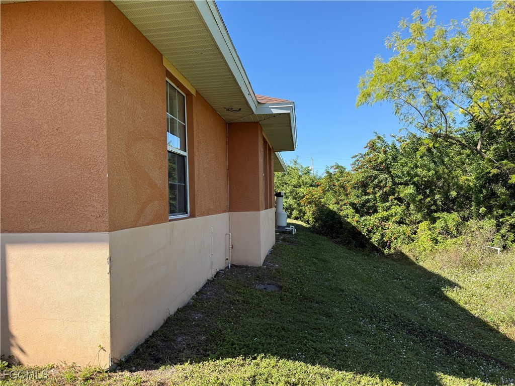 633 Alabama Road South, Unit 635 Lehigh Acres, FL 33974 - Photo 4 of 19 a view of a backyard
