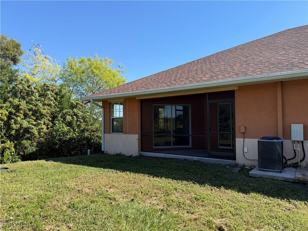 633 Alabama Road South, Unit 635 Lehigh Acres, FL 33974 - Photo 5 of 19 a view of a house with a yard